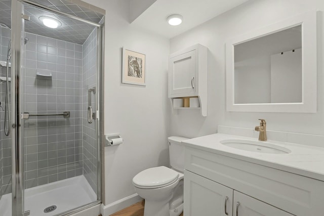 963 Heritage Hls Unit C, Somers, NY 10589 - bathroom featuring vanity, a stall shower, toilet, and baseboards