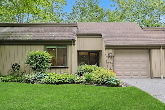 963 Heritage Hls Unit C, Somers, NY 10589 - mid-century home with asphalt driveway, a garage, roof with shingles, and a front lawn