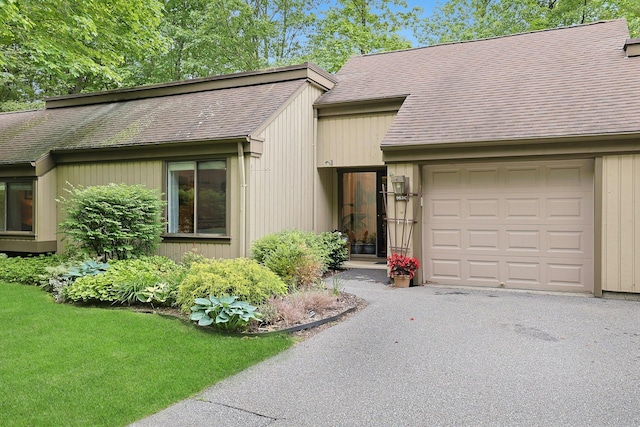 963 Heritage Hls Unit C, Somers, NY 10589 - mid-century inspired home featuring an attached garage, driveway, and roof with shingles