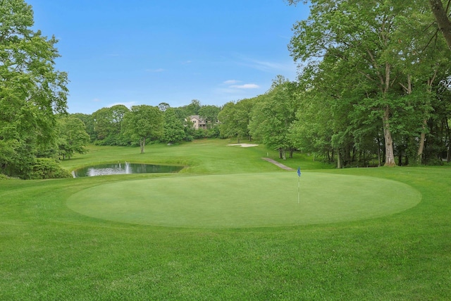 963 Heritage Hls Unit C, Somers, NY 10589 - view of home's community featuring a yard, an area to practice putting, view of golf course, and a water view