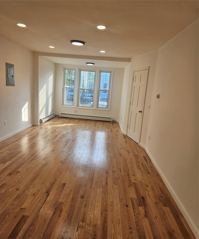 495 Milford St, Brooklyn, NY 11208 - spare room with baseboard heating, hardwood / wood-style flooring, recessed lighting, and electric panel