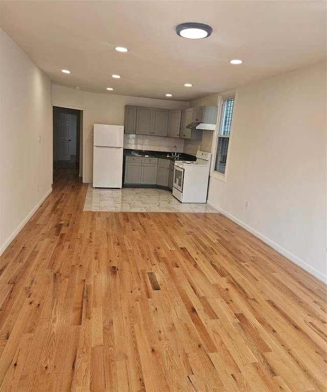 495 Milford St, Brooklyn, NY 11208 - kitchen with white appliances, gray cabinetry, light wood finished floors, and recessed lighting
