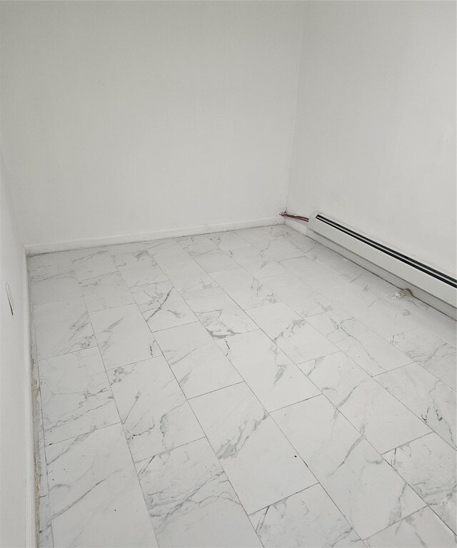 495 Milford St, Brooklyn, NY 11208 - unfurnished room featuring marble finish floors and a baseboard heating unit