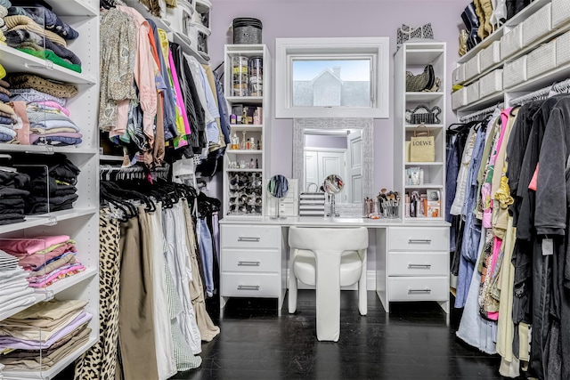 walk in closet featuring dark wood-style flooring