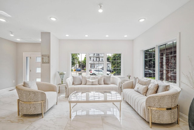 345 Washington Ave, Cedarhurst, NY 11516 - living area featuring light marble finish floors, plenty of natural light, recessed lighting, and baseboards
