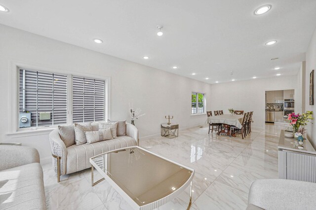 345 Washington Ave, Cedarhurst, NY 11516 - living area with light marble finish floors, recessed lighting, and baseboards