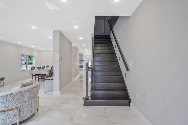 345 Washington Ave, Cedarhurst, NY 11516 - stairs with marble tiled flooring, baseboards, and recessed lighting