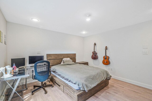 345 Washington Ave, Cedarhurst, NY 11516 - bedroom with baseboards, wood finished floors, an office area, and recessed lighting