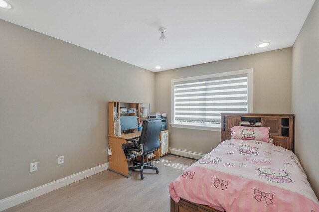 345 Washington Ave, Cedarhurst, NY 11516 - bedroom featuring light wood-style floors, baseboards, recessed lighting, a desk, and a baseboard heating unit