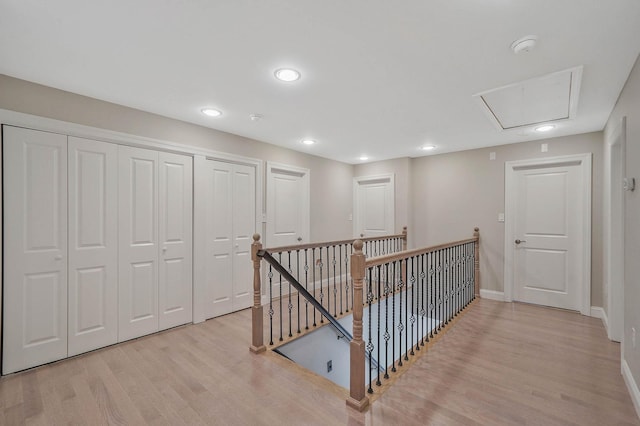 345 Washington Ave, Cedarhurst, NY 11516 - corridor with an upstairs landing, light wood finished floors, attic access, baseboards, and recessed lighting