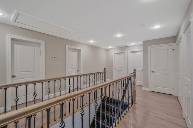 345 Washington Ave, Cedarhurst, NY 11516 - hallway featuring light wood-style flooring, an upstairs landing, attic access, and recessed lighting