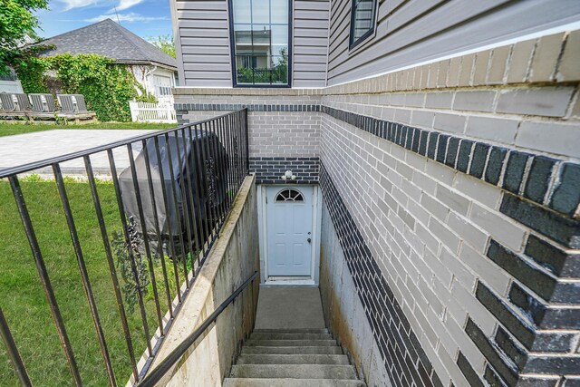 345 Washington Ave, Cedarhurst, NY 11516 - view of exterior entry featuring brick siding
