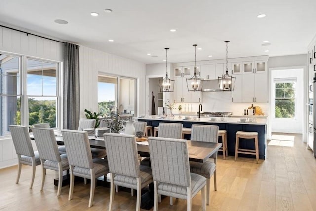 9 Sienna Ct, Dix Hills, NY 11746 - dining area featuring light wood finished floors, recessed lighting, and a chandelier