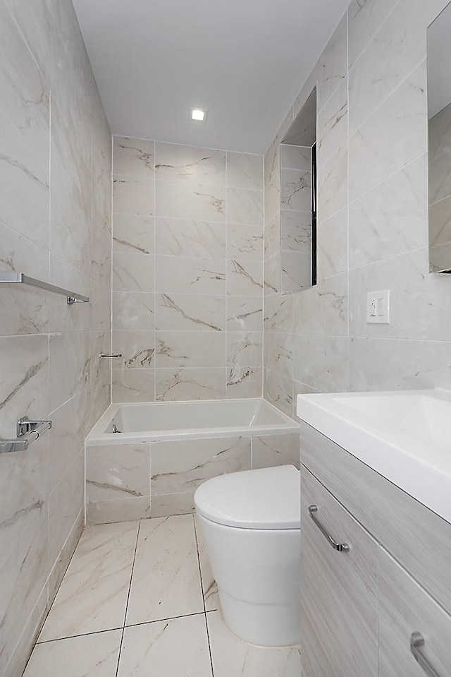 370 Rutland Rd, Brooklyn, NY 11225 - full bathroom featuring tile walls, a tub to relax in, and vanity