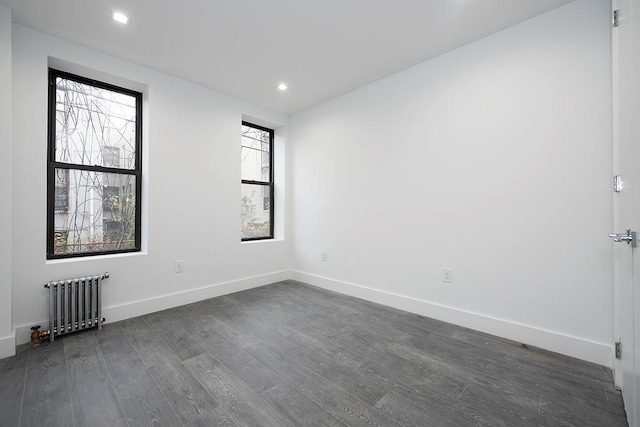 370 Rutland Rd, Brooklyn, NY 11225 - empty room featuring radiator heating unit, dark wood-style flooring, plenty of natural light, and recessed lighting