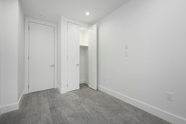 370 Rutland Rd, Brooklyn, NY 11225 - unfurnished bedroom with wood finished floors, a closet, and recessed lighting