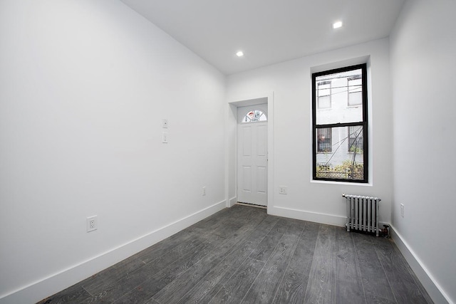 370 Rutland Rd, Brooklyn, NY 11225 - unfurnished room featuring radiator heating unit, dark wood-style floors, and recessed lighting