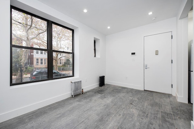 370 Rutland Rd, Brooklyn, NY 11225 - unfurnished room with radiator heating unit, wood finished floors, healthy amount of natural light, recessed lighting, and a smoke detector