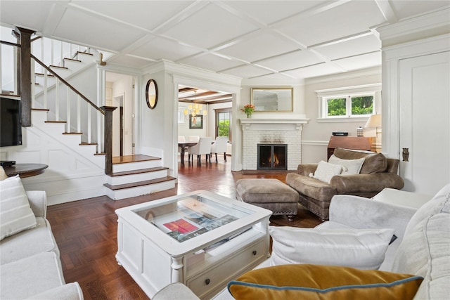 58 Garden St, Garden City, NY 11530 - living area featuring healthy amount of natural light, coffered ceiling, stairway, and a fireplace