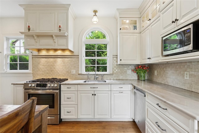58 Garden St, Garden City, NY 11530 - kitchen with appliances with stainless steel finishes, light countertops, and plenty of natural light