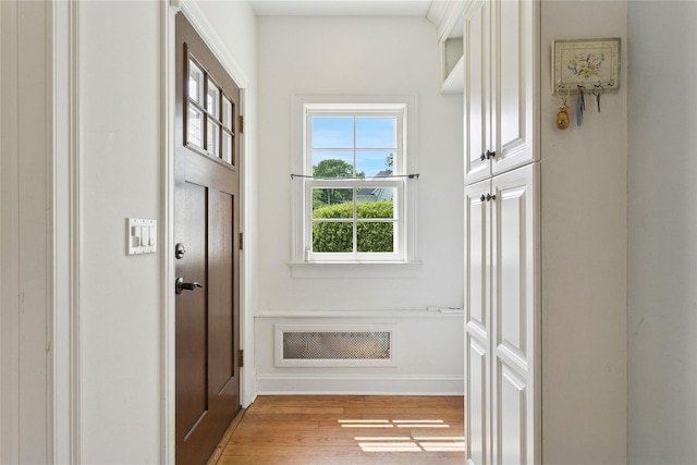 58 Garden St, Garden City, NY 11530 - entryway featuring light wood-style floors and baseboards