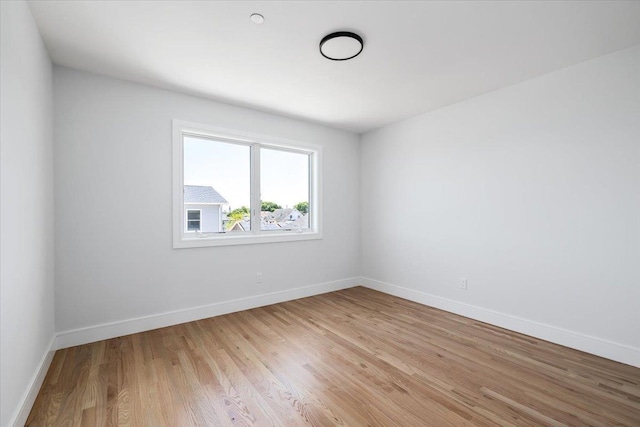 12 Pershing Pl, Island Park, NY 11558 - empty room featuring light wood-style flooring and baseboards