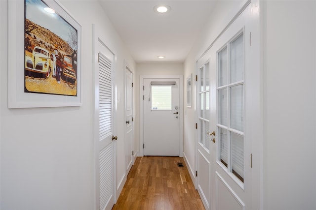 10 Head Of Pond Rd Unit 8, Water Mill, NY 11976 - entryway featuring recessed lighting, light wood-style flooring, and baseboards