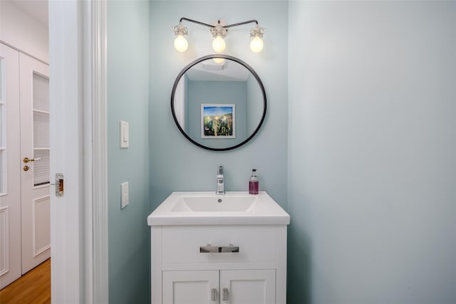 10 Head Of Pond Rd Unit 8, Water Mill, NY 11976 - bathroom featuring vanity and wood finished floors