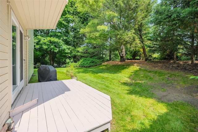 10 Head Of Pond Rd Unit 8, Water Mill, NY 11976 - wooden terrace featuring area for grilling, a lawn, and view of scattered trees