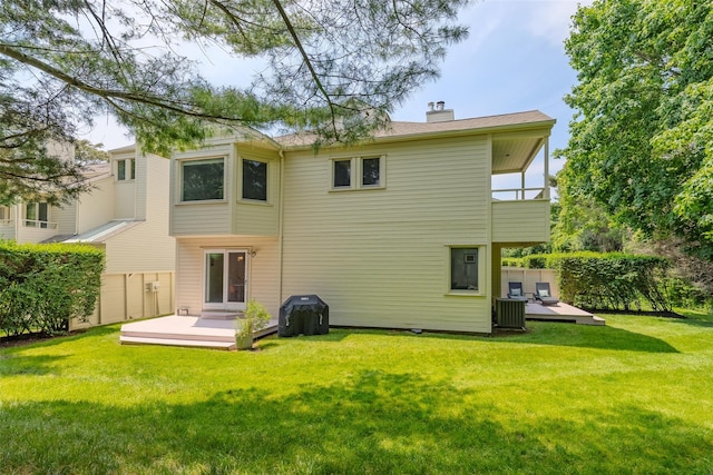 10 Head Of Pond Rd Unit 8, Water Mill, NY 11976 - back of house featuring a wooden deck, a chimney, and central air condition unit