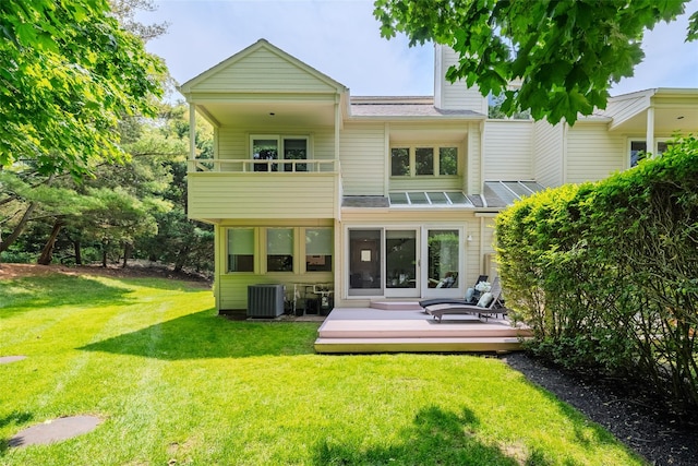 10 Head Of Pond Rd Unit 8, Water Mill, NY 11976 - back of property with a balcony, central air condition unit, a lawn, a deck, and a chimney
