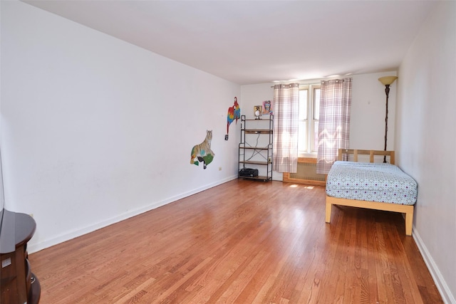 67-25 Clyde St Unit 2L, Forest Hills, NY 11375 - bedroom with light wood-style floors and baseboards