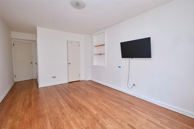67-25 Clyde St Unit 2L, Forest Hills, NY 11375 - unfurnished bedroom featuring light wood finished floors and baseboards