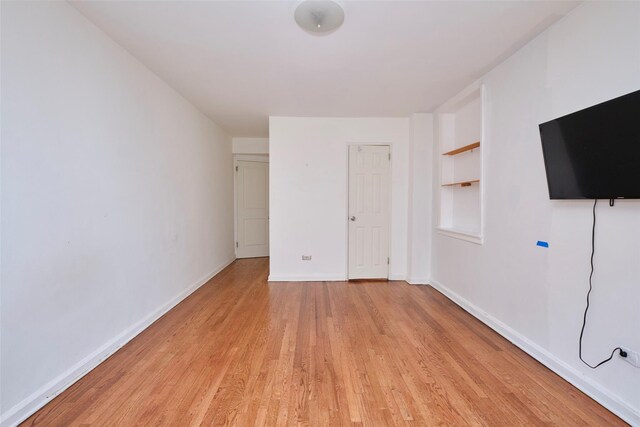 67-25 Clyde St Unit 2L, Forest Hills, NY 11375 - unfurnished bedroom featuring light wood-type flooring and baseboards