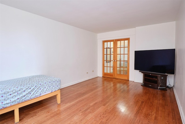 67-25 Clyde St Unit 2L, Forest Hills, NY 11375 - interior space featuring french doors, wood finished floors, and baseboards