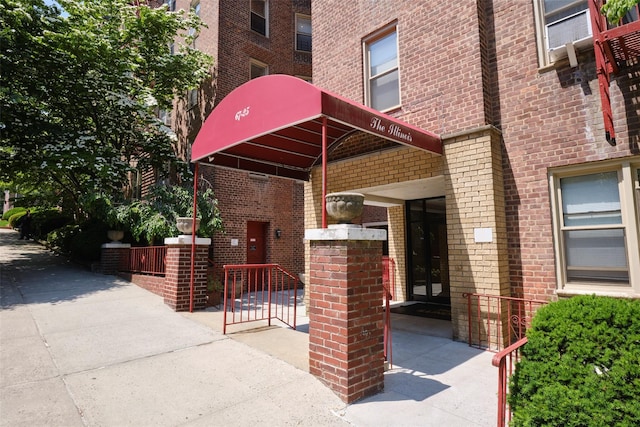 67-25 Clyde St Unit 2L, Forest Hills, NY 11375 - doorway to property with brick siding