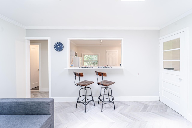 9 Higgins Trl, Monroe, NY 10950 - kitchen featuring a kitchen breakfast bar, freestanding refrigerator, and ornamental molding