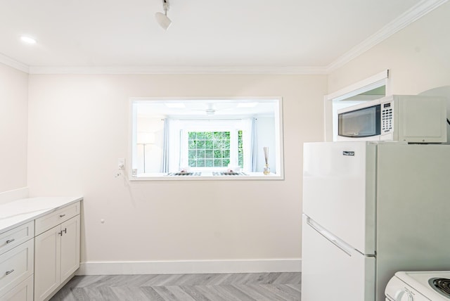 9 Higgins Trl, Monroe, NY 10950 - kitchen with white appliances, crown molding, light countertops, and white cabinets
