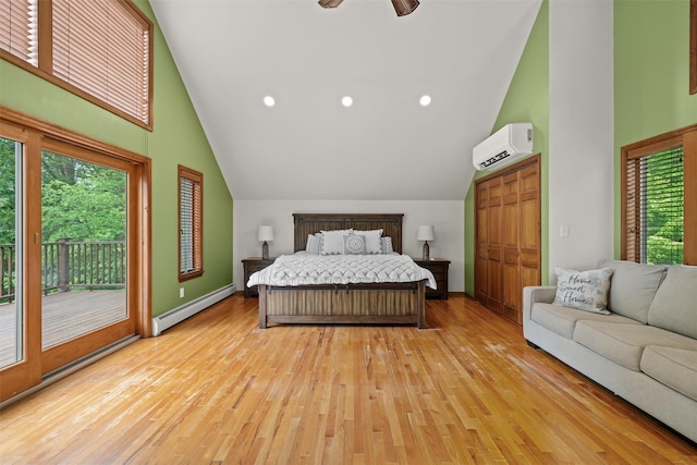 1775 Plank Rd, Forestburgh, NY 12777 - bedroom featuring a baseboard heating unit, access to exterior, a wall mounted AC, light wood finished floors, and high vaulted ceiling