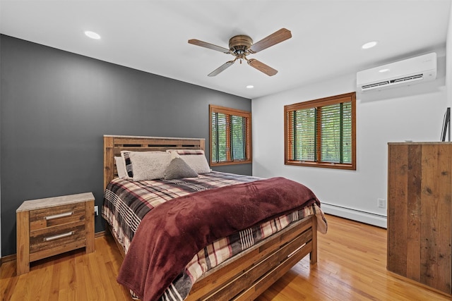 1775 Plank Rd, Forestburgh, NY 12777 - bedroom with a wall unit AC, a baseboard heating unit, wood finished floors, ceiling fan, and recessed lighting