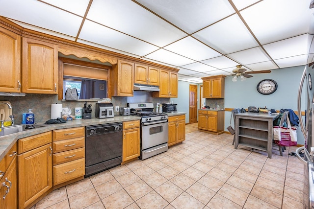 5801 59th St, Maspeth, NY 11378 - kitchen with black dishwasher, stainless steel gas range oven, under cabinet range hood, light tile patterned floors, and a ceiling fan