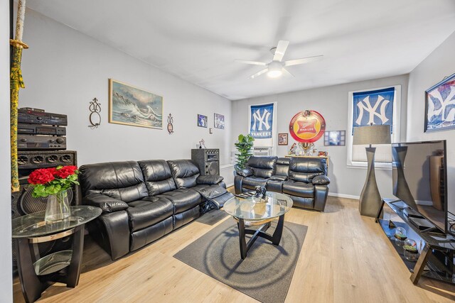 5801 59th St, Maspeth, NY 11378 - living room featuring a ceiling fan, wood finished floors, and baseboards