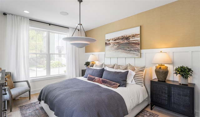 3502 Bennington Dr Unit 113, Fishkill, NY 12524 - bedroom with wood finished floors and a wainscoted wall