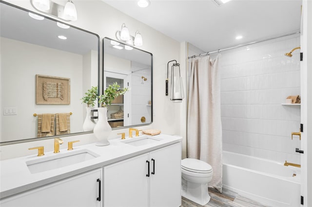 3502 Bennington Dr Unit 113, Fishkill, NY 12524 - full bathroom featuring toilet, wood finished floors, double vanity, shower / tub combo, and recessed lighting