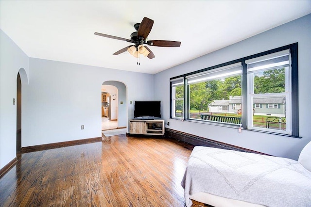 18 Gerow Ln, Cornwall, NY 12553 - bedroom with arched walkways, wood finished floors, baseboards, and ceiling fan