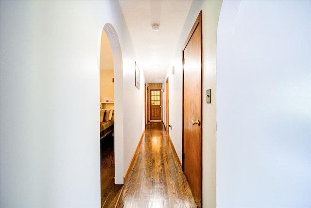 18 Gerow Ln, Cornwall, NY 12553 - hall with arched walkways, wood finished floors, and baseboards