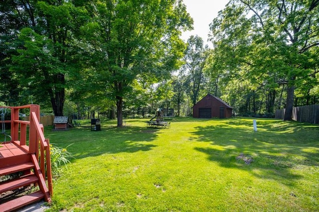 18 Gerow Ln, Cornwall, NY 12553 - view of yard with a wooden deck, an outbuilding, and view of wooded area