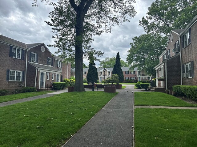 224-43A 64th Ave Unit 43A/545, Oakland Gardens, NY 11364 - view of property's community with a residential view and a yard