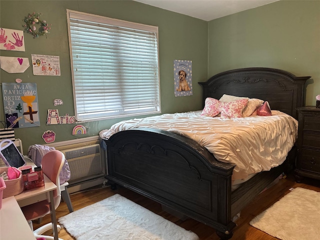 224-43A 64th Ave Unit 43A/545, Oakland Gardens, NY 11364 - bedroom featuring wood finished floors and a wall unit AC