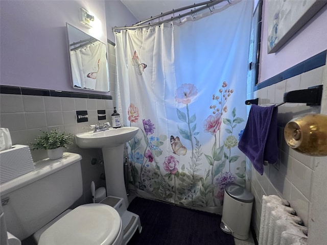 224-43A 64th Ave Unit 43A/545, Oakland Gardens, NY 11364 - full bathroom featuring radiator, tile walls, toilet, and wainscoting